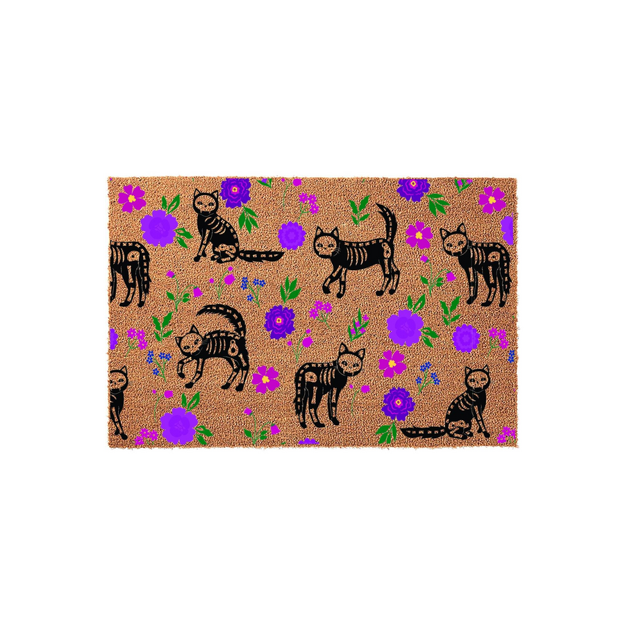Halloween Skeleton Cat Coir Doormat featuring a repeating pattern of black feline skeletons and vibrant purple flowers on a natural tan fiber background, creating a festive and spooky entryway decor piece for the fall season.
