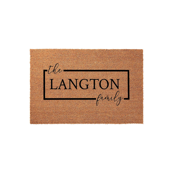 Personalized family name coir doormat featuring a clean rectangular border design with elegant script and bold typography, providing a welcoming entrance decor piece for any home front porch or entryway on a plain white
