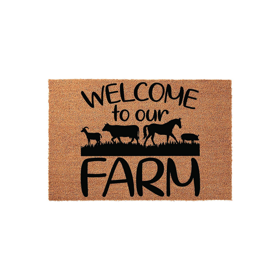 Farm Welcome Doormat featuring a natural coir texture with black printed text that reads Welcome to our FARM, accompanied by silhouettes of a goat, cow, horse, and pig standing in a grassy field on a plain white studio background.