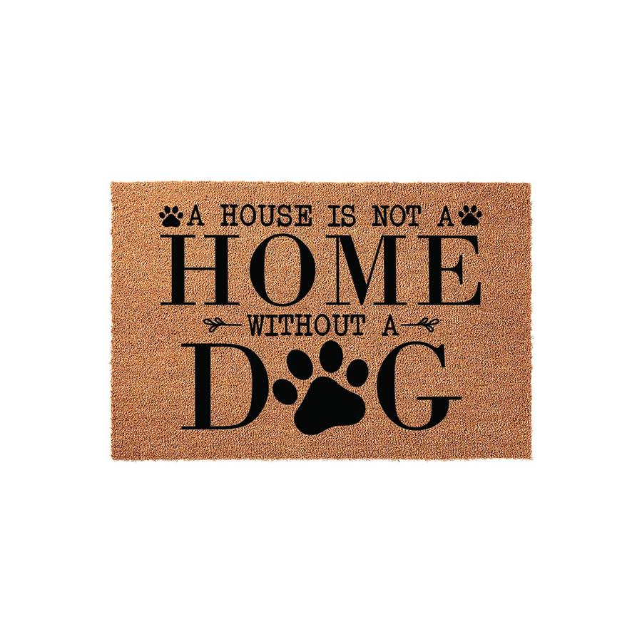 Dog lover coir doormat featuring the phrase A House Is Not A Home Without A Dog in bold black lettering, with a large paw print replacing the letter O in the word dog, set against a natural tan textured fiber background on a
