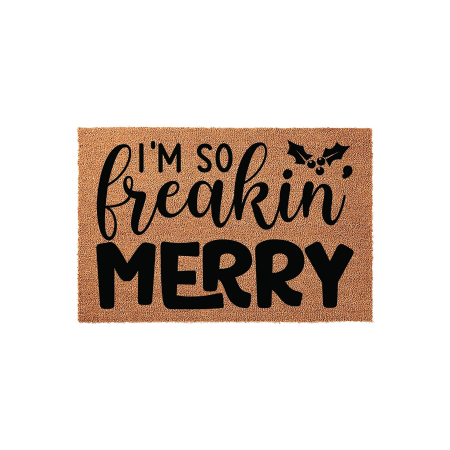 I'm So Freakin' Merry Christmas Doormat featuring a natural coir fiber texture with bold black lettering and a festive holly berry graphic, creating a fun and humorous holiday welcome for your front porch entryway decor this