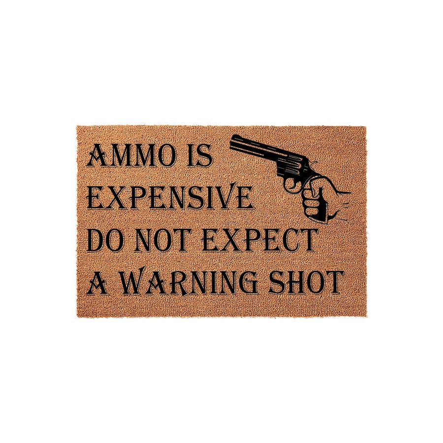 Funny Ammo Is Expensive Do Not Expect A Warning Shot doormat made of natural coir fibers, featuring a black graphic of a revolver and bold text on a plain white background for a humorous front porch entrance decor statement piece.