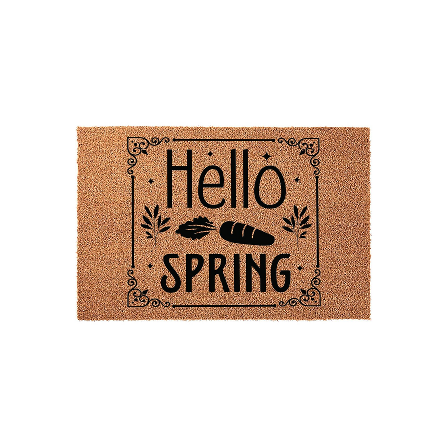 Hello Spring coir doormat featuring a natural brown fiber texture with black printed text and a decorative border, showcasing a seasonal carrot and leaf design that adds a festive touch to any front porch or entryway decor.