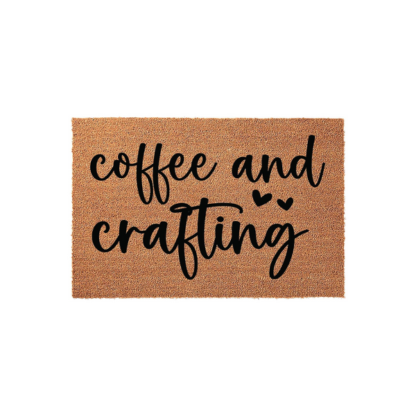 Coffee and Crafting coir doormat featuring a natural brown fiber texture and bold black script lettering, centered on a clean white background to showcase the fun hobby-themed design for a front porch or entryway decor.