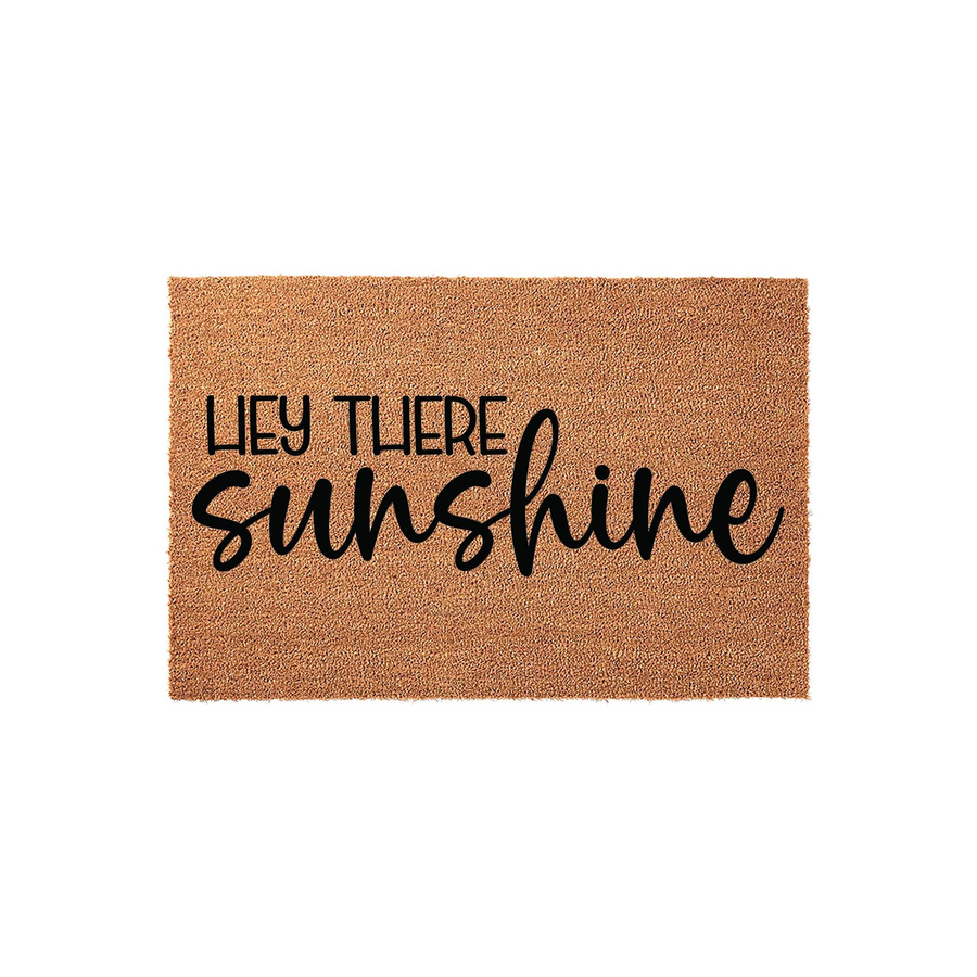 Hey There Sunshine coir doormat featuring a natural brown fiber texture and bold black typography, creating a cheerful and welcoming entrance decor piece for your front porch or home entryway that greets guests with a friendly