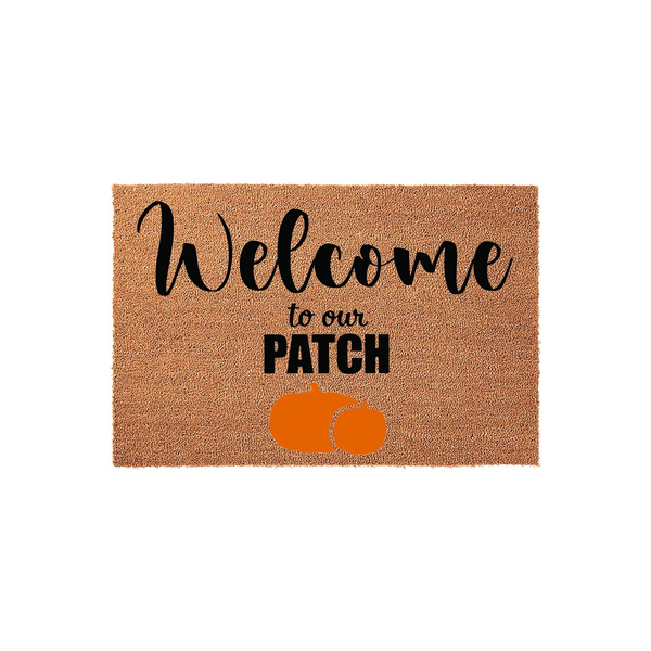Welcome to our Patch pumpkin coir doormat featuring a natural tan fiber texture with black script lettering and two bright orange pumpkins printed at the bottom, creating a festive fall entryway decor piece for your front porch.