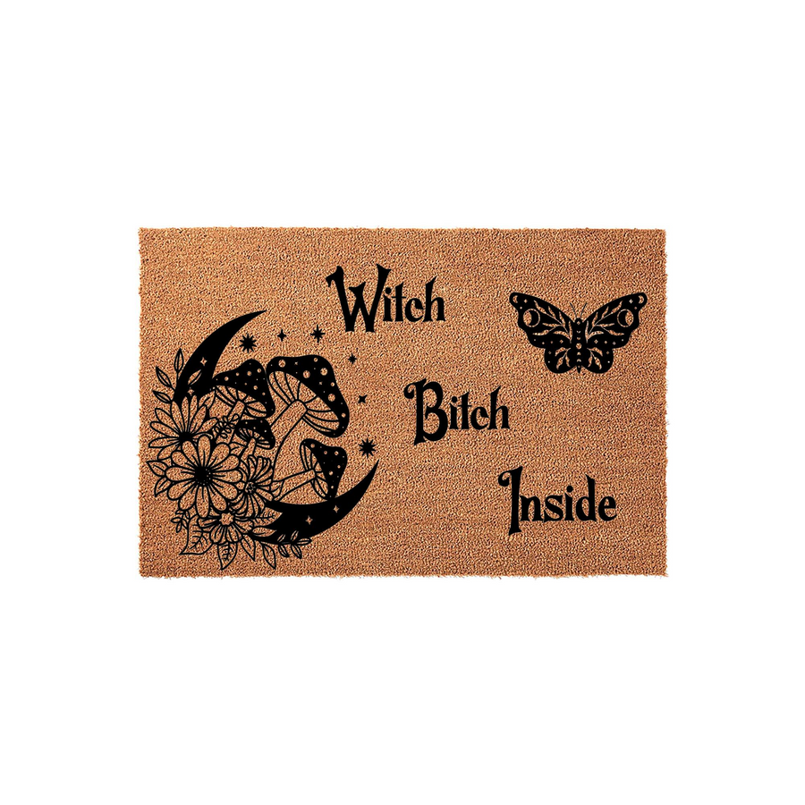 Witch Bitch Inside coir doormat featuring a black printed design of a crescent moon, mushrooms, wildflowers, and a butterfly on a natural tan fiber background, creating a fun and spooky entryway decor piece for a modern home.