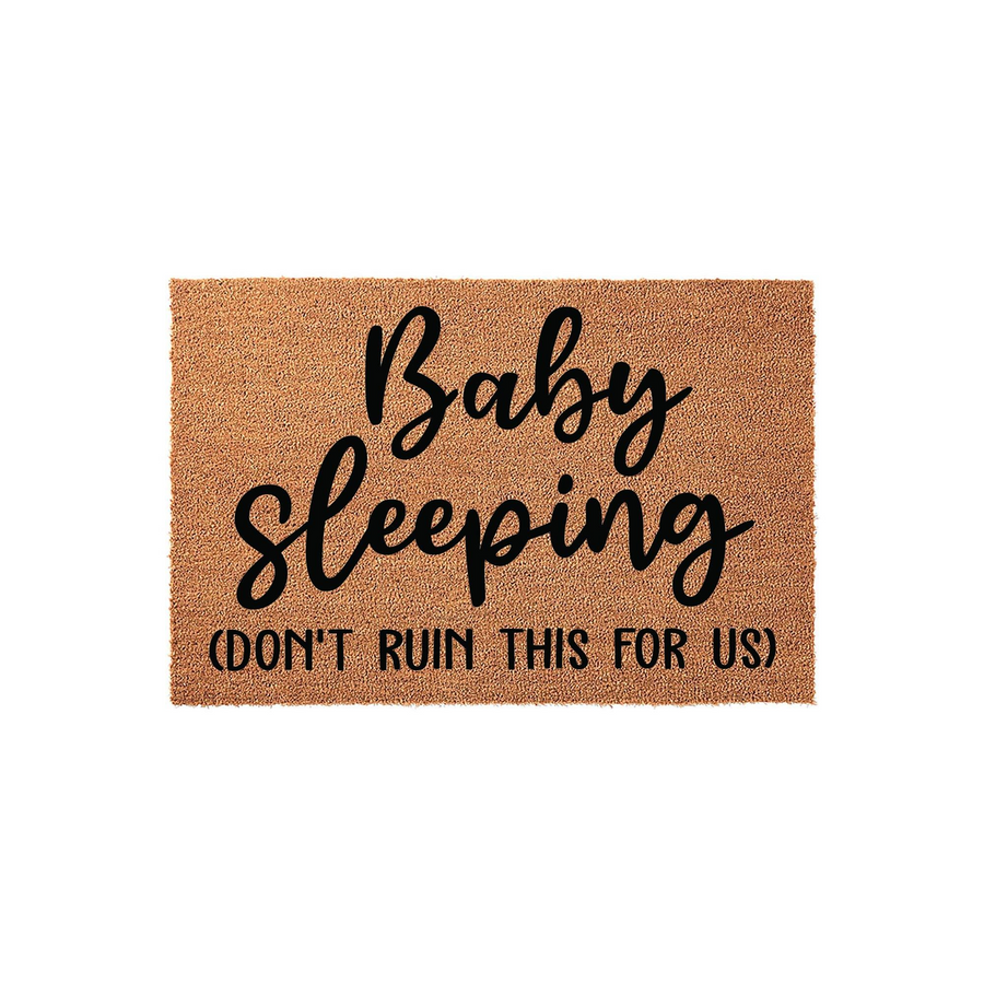 Baby Sleeping Don't Ruin This For Us doormat featuring a natural coir texture with bold black lettering that humorously warns visitors to be quiet, making it a fun and practical front porch decor piece for new parents.