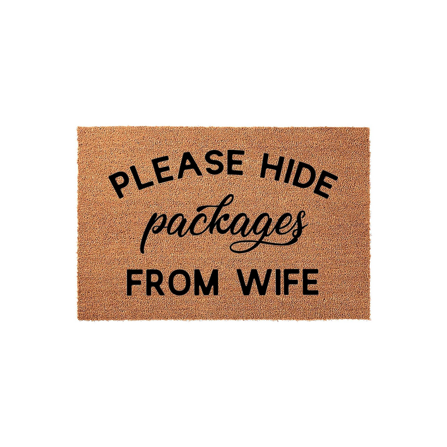 Funny Please Hide Packages From Wife Doormat made of natural coir fibers with a clean white background, featuring bold black lettering that creates a humorous and practical entryway decor piece for any home porch or front door