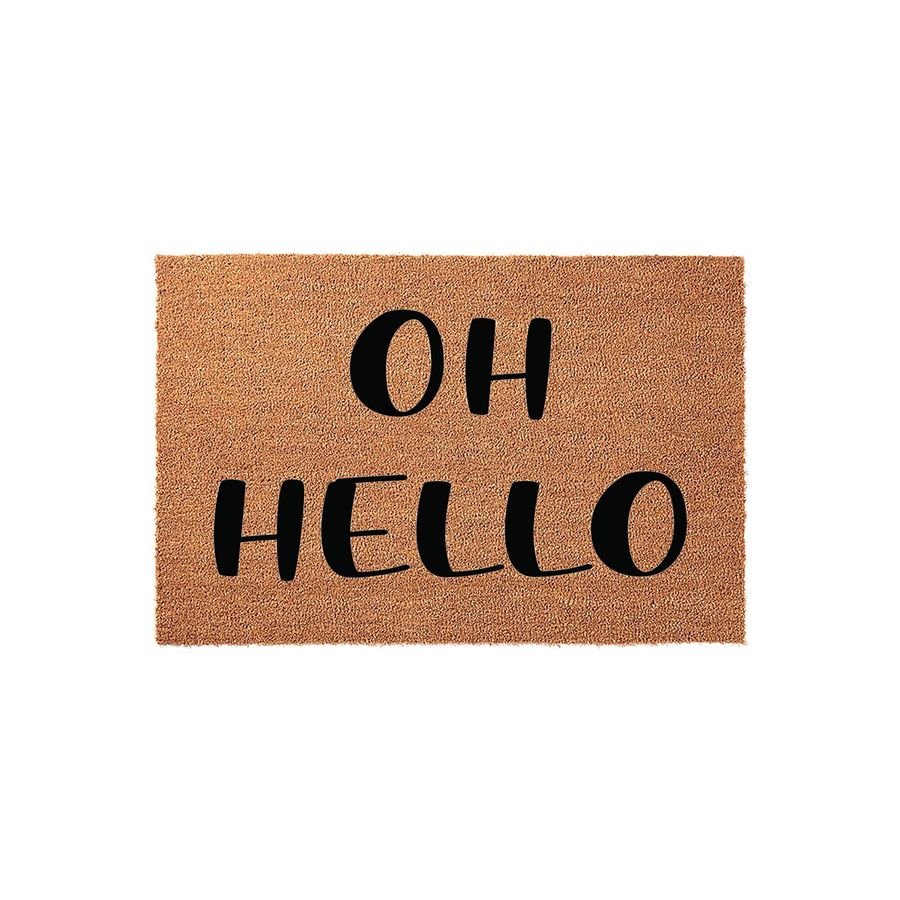 Oh Hello coir doormat featuring a natural brown fiber texture and bold black lettering, providing a welcoming and stylish entrance decor piece for your front porch or home entryway that greets guests with a simple, friendly