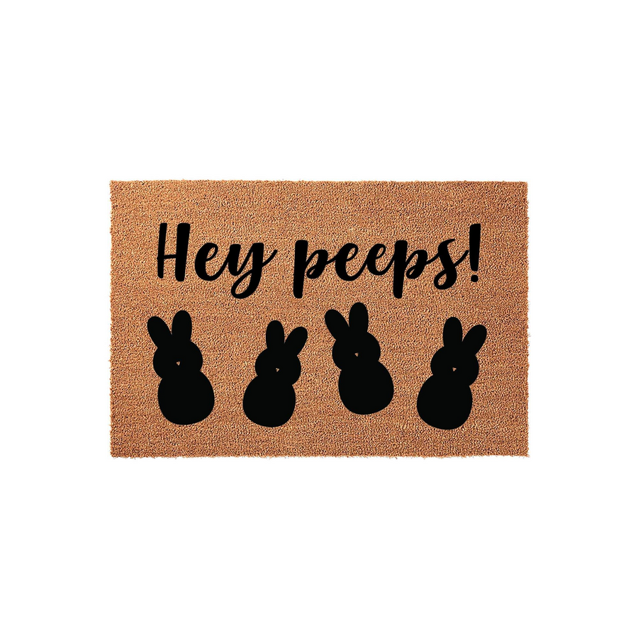 Hey Peeps Easter Doormat made of natural coir fiber, featuring a playful black script font and four cute bunny silhouettes printed across the center, perfect for adding a festive touch to your front porch decor during the spring