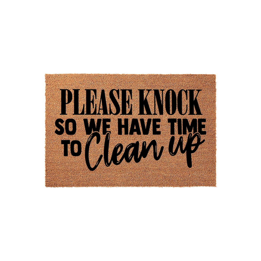 Funny Please Knock So We Have Time To Clean Up doormat made of natural coir fiber with bold black lettering, featuring a humorous message that adds a playful and welcoming touch to any front porch or entryway decor for your home.