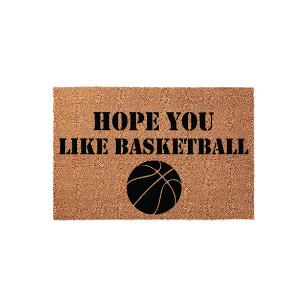 Hope You Like Basketball Coir Doormat featuring a natural tan fiber texture with bold black text and a basketball graphic, making it a fun front porch decor choice for sports fans who want to welcome guests to their home in style.