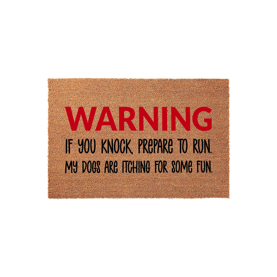 Funny Dog Warning Doormat featuring a natural coir texture with bold red and black text that reads Warning If You Knock Prepare To Run My Dogs Are Itching For Some Fun, making it a humorous outdoor welcome mat for any pet owner