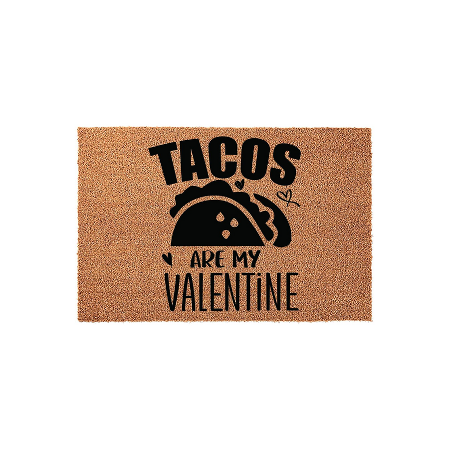 Tacos Are My Valentine coir doormat featuring a natural brown fiber texture and bold black text with a taco graphic, creating a fun and festive entryway decor piece for a food lover celebrating the holiday on a plain white