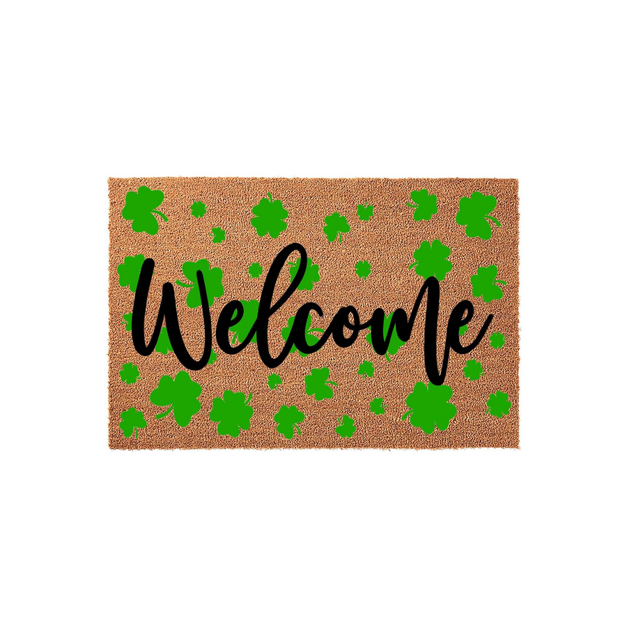 St. Patrick's Day Welcome Doormat featuring a natural coir texture decorated with vibrant green shamrocks and the word Welcome written in a bold black script font, creating a festive look for your front porch entry decor.