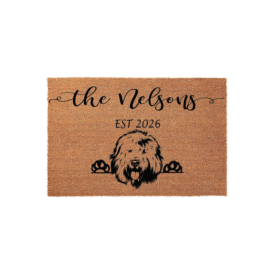 Personalized Goldendoodle Dog Doormat featuring a cute illustrated dog peeking over the bottom edge, customized with a family name and established year printed in black ink on a natural tan coir fiber welcome mat for your front