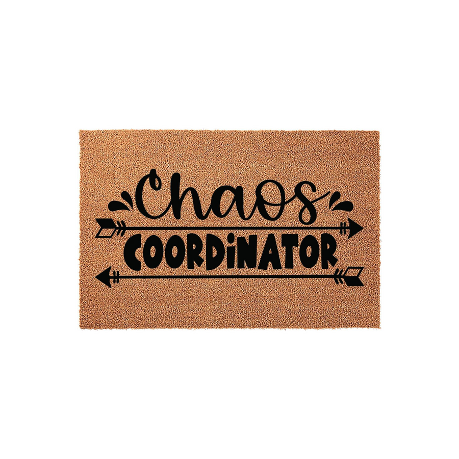 Chaos Coordinator natural coir doormat featuring bold black typography and decorative arrow accents, set against a clean white background to showcase the textured fiber surface of this humorous front porch welcome mat for any