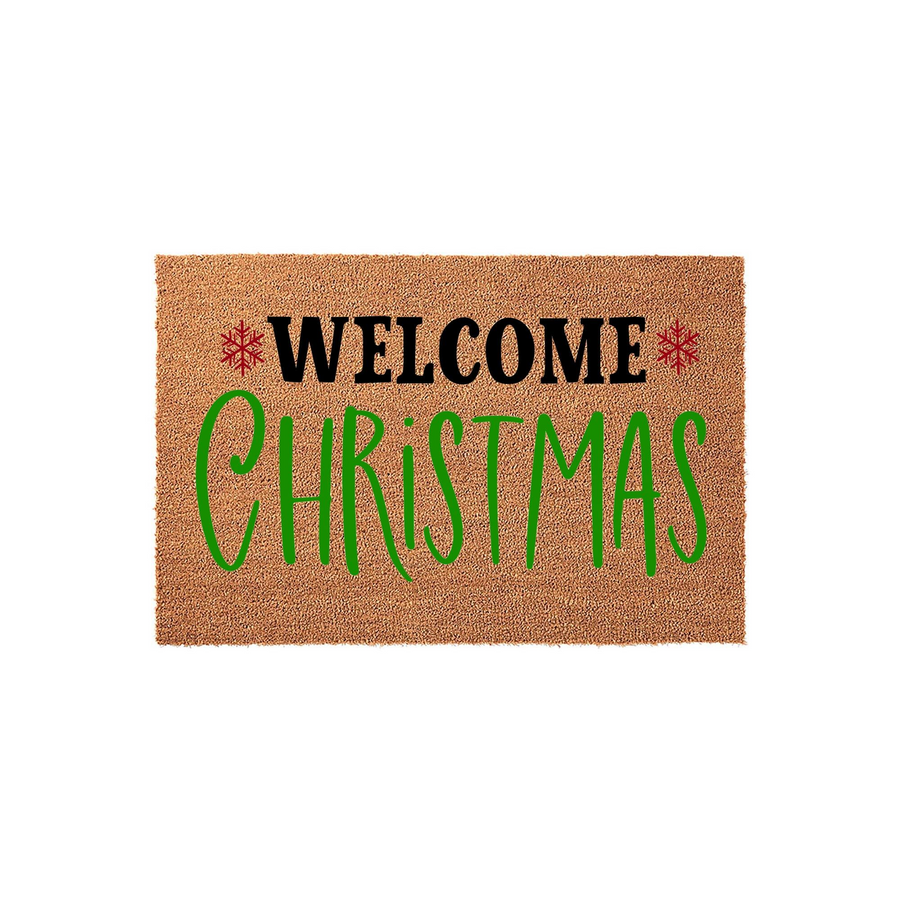 Christmas Welcome Doormat featuring a natural coir texture with bold black lettering for Welcome and large green script text for Christmas, accented by two small red snowflakes on a plain white background for a festive holiday