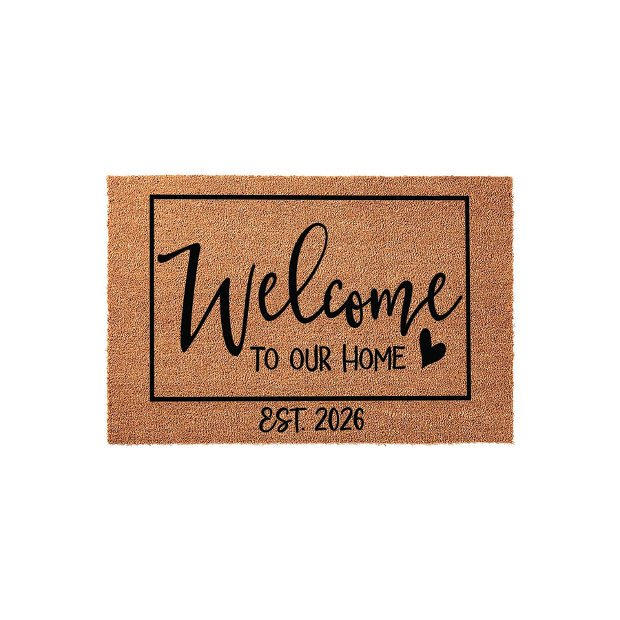 Personalized Welcome To Our Home Doormat featuring a natural coir texture with a black rectangular border, elegant script lettering, and the established year 2026 printed in the center for a custom housewarming front porch decor