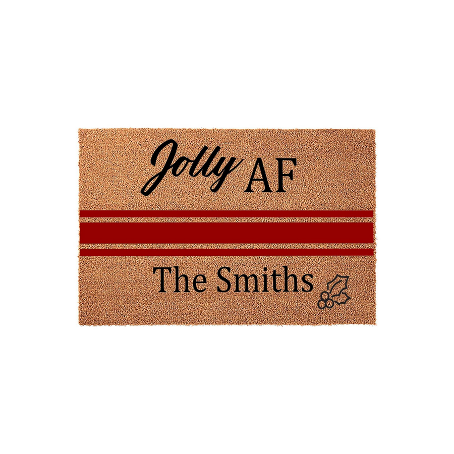Personalized Christmas doormat featuring a natural coir texture with a bold red stripe, displaying the text Jolly AF and a custom family name with a small holly leaf accent, perfect for a festive and humorous holiday home