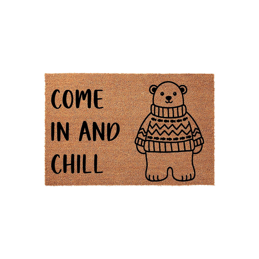Come In And Chill Bear Doormat featuring a cute illustrated bear wearing a cozy patterned sweater on a natural brown coir background, making this a fun and welcoming front porch decor piece for any home entrance or entryway.
