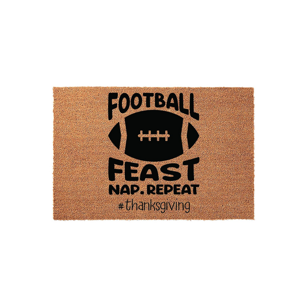 Football Feast Nap Repeat Thanksgiving Doormat featuring a natural coir texture with bold black text and a football graphic, creating a festive seasonal entryway decor piece for your home during the fall holiday season and game
