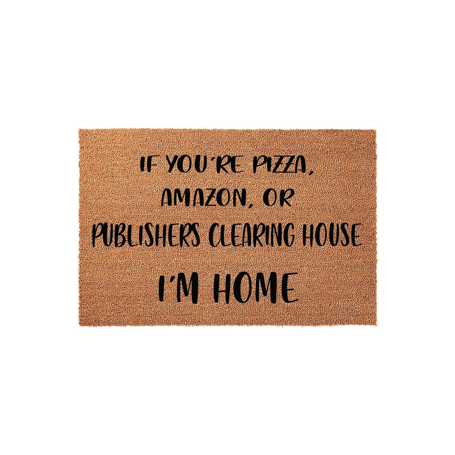 Funny Doormat with text that reads If You Are Pizza, Amazon, Or Publishers Clearing House I Am Home, featuring bold black lettering printed on a natural brown coir fiber mat against a clean white studio background for a front