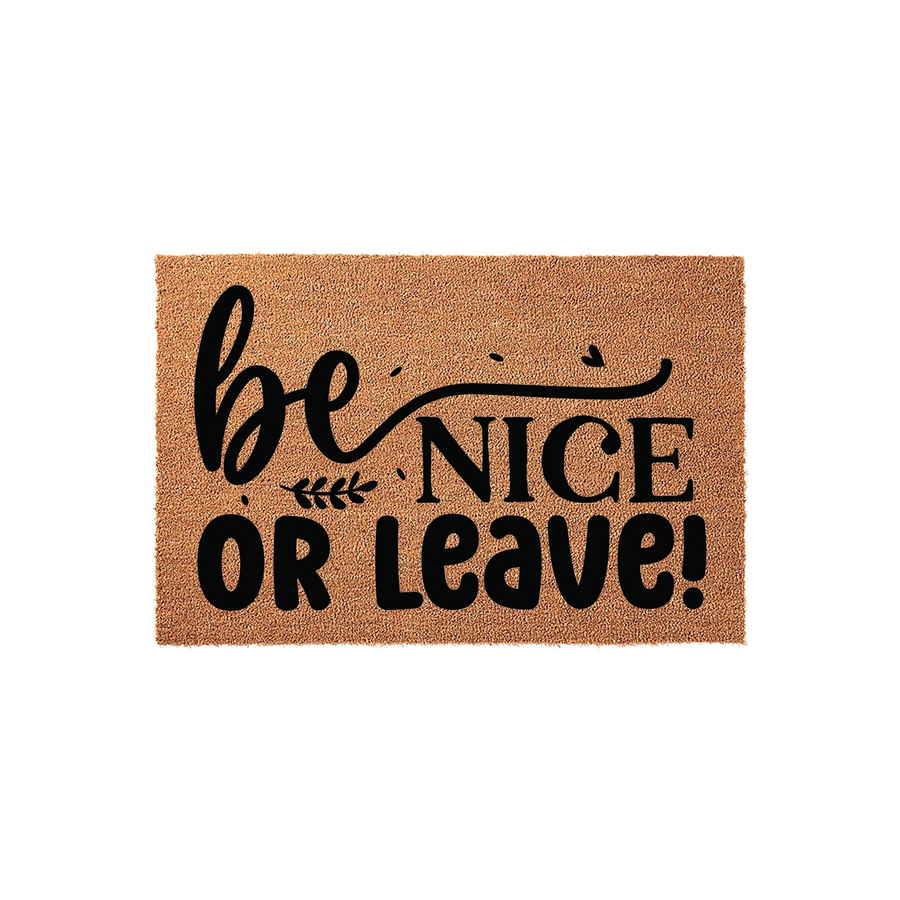 Be Nice Or Leave coir doormat featuring bold black typography on a natural brown fiber background, creating a funny and welcoming front porch entrance decor piece that adds personality to any home entryway or apartment doorstep.