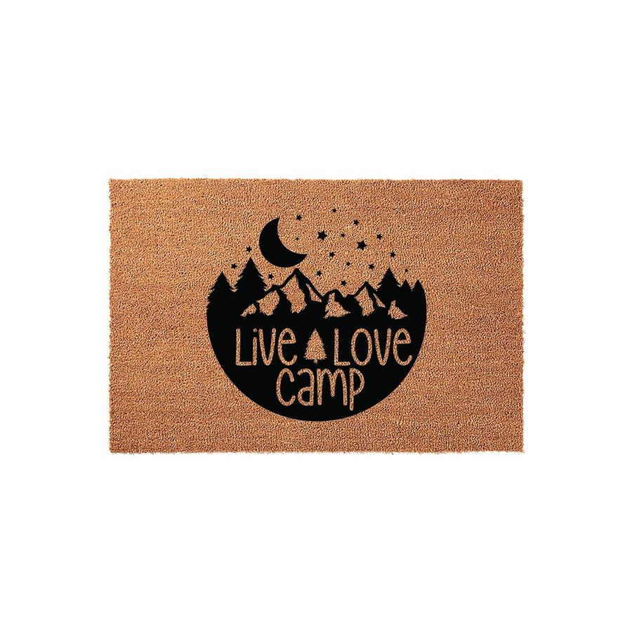 Live Love Camp outdoor doormat featuring a natural coir texture with a black printed design of mountains, pine trees, a crescent moon, and stars, creating a rustic aesthetic for any camping enthusiast or outdoor home entryway