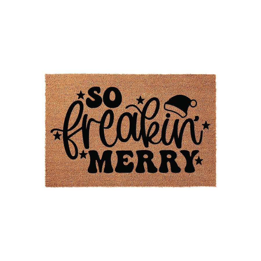 So Freakin Merry Christmas doormat made of natural coir fiber with a rustic brown texture, featuring bold black typography and a festive Santa hat icon to bring a fun holiday spirit to your front porch entryway decor this winter