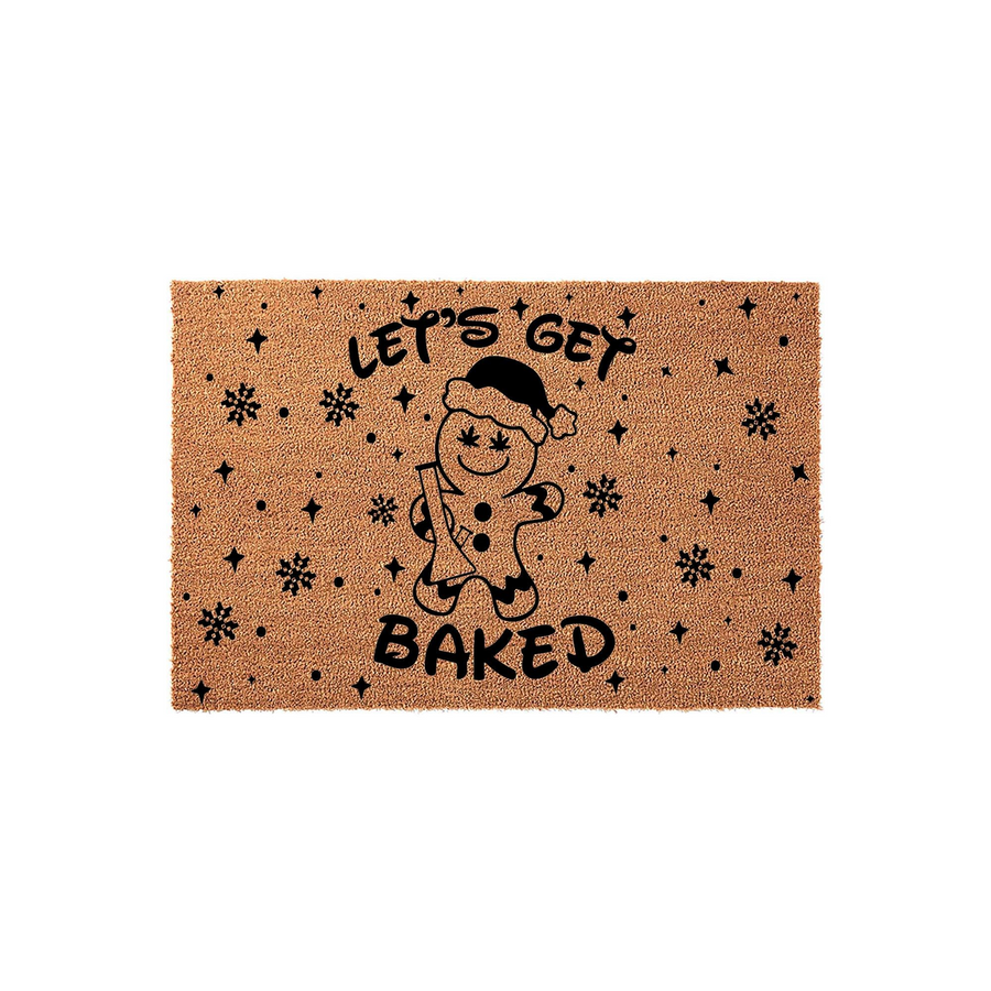 Let's Get Baked Gingerbread Man Doormat featuring a natural coir texture with a black printed design of a smiling gingerbread character wearing a Santa hat, surrounded by festive snowflakes and stars on a plain white background.