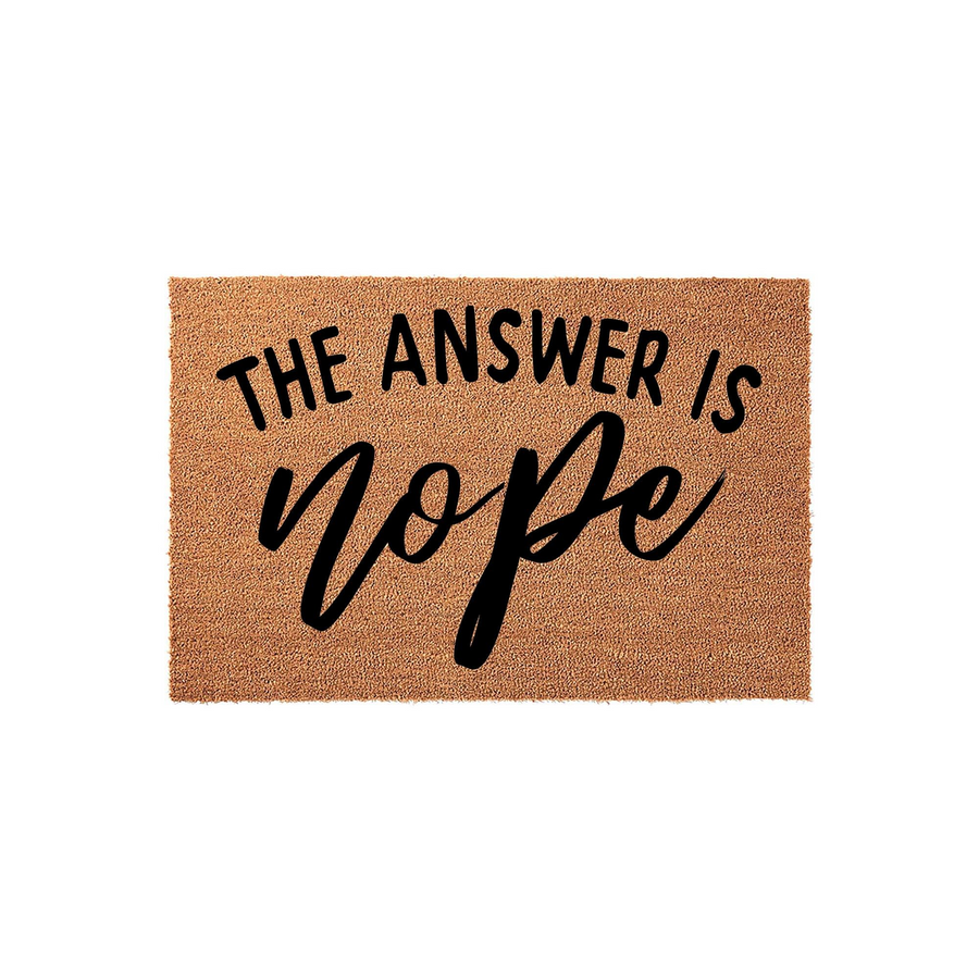 Funny Nope Doormat made of natural coir fiber with a rectangular shape, featuring the bold black text The Answer Is Nope printed in a mix of modern sans-serif and script fonts against a textured brown background for a front porch