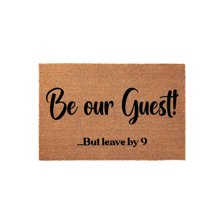 Funny Be Our Guest But Leave By 9 coir doormat featuring bold black script and serif typography on a natural brown textured fiber background, perfect for adding a humorous touch to your front porch entryway decor.