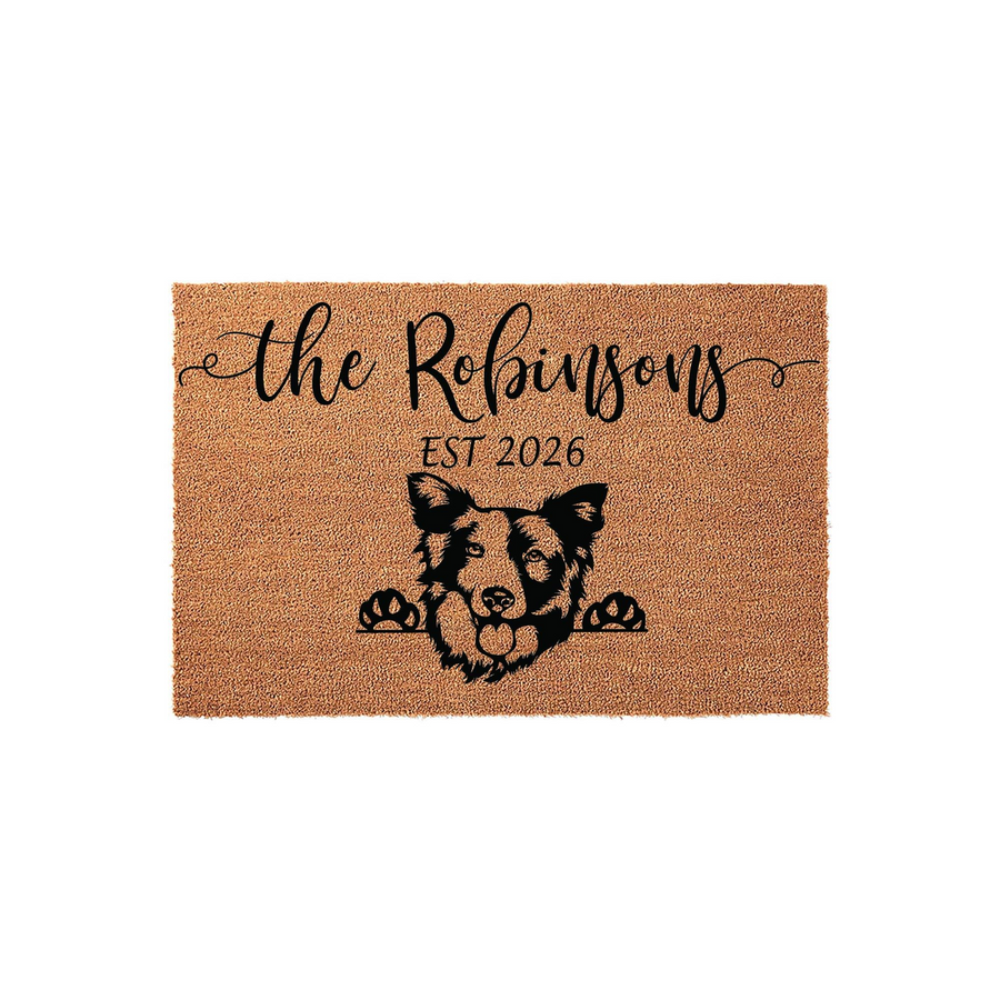 Personalized Border Collie coir doormat featuring a cute dog peeking over the edge, customized with a family name and established year in black script on a natural tan fiber background for a welcoming front porch entrance.