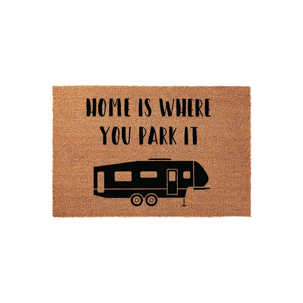 Home Is Where You Park It camper doormat featuring a natural coir texture and a black silhouette of a fifth-wheel travel trailer, perfect for adding a fun and welcoming touch to your RV campsite entrance or outdoor living space.