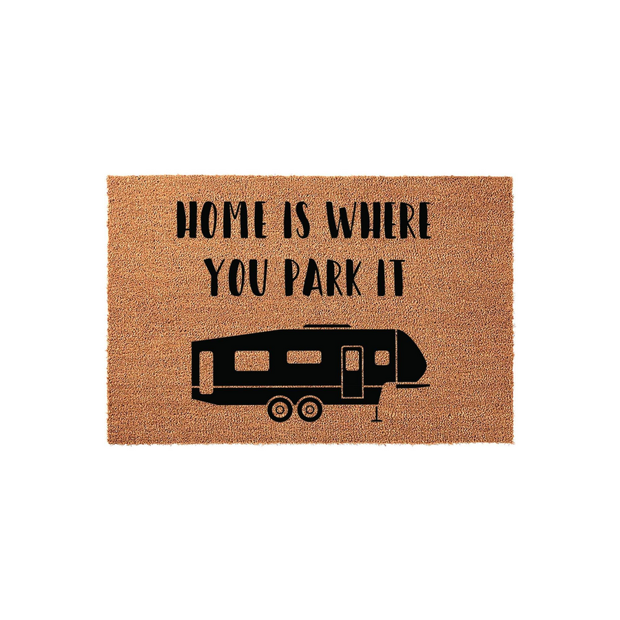 Home Is Where You Park It camper doormat featuring a natural coir texture and a black silhouette of a fifth-wheel travel trailer, perfect for adding a fun and welcoming touch to your RV campsite entrance or outdoor living space.