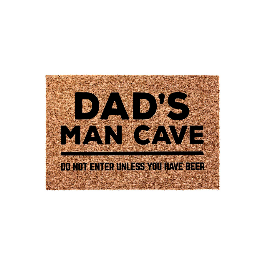 Dad's Man Cave coir doormat featuring bold black text that reads Dad's Man Cave and Do Not Enter Unless You Have Beer, set against a plain white background to highlight the natural fiber texture of this humorous home decor item.