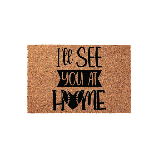 Baseball Heart Welcome Doormat featuring the text I'll See You At Home with a baseball-themed heart graphic, printed in black on a natural tan coir fiber mat against a clean white background for a sporty front porch entrance.