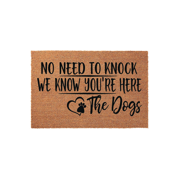 Funny Dog Welcome Doormat featuring a natural coir texture and bold black text that reads No Need To Knock We Know You Are Here The Dogs, complete with a cute paw print heart design for a charming entryway decor piece for pet