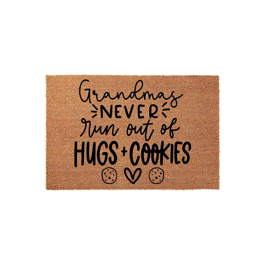 Grandmas Never Run Out of Hugs and Cookies coir doormat features a natural tan fiber texture with black text and cute cookie and heart icons, making it a sweet and welcoming entryway decor piece for a loving home entrance.