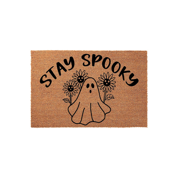 Stay Spooky ghost sunflower doormat featuring a cute illustrated ghost surrounded by flowers on a natural coir fiber background, making this a fun and festive Halloween front porch decor piece for your home entrance during the