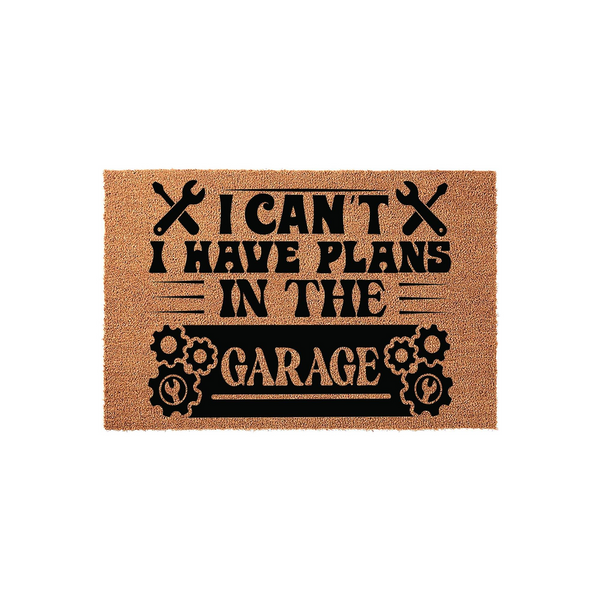 Funny Garage Doormat featuring a natural coir texture with black printed text that reads I Can't I Have Plans In The Garage, accented by wrench and gear icons for a rustic workshop aesthetic on a plain white studio background.
