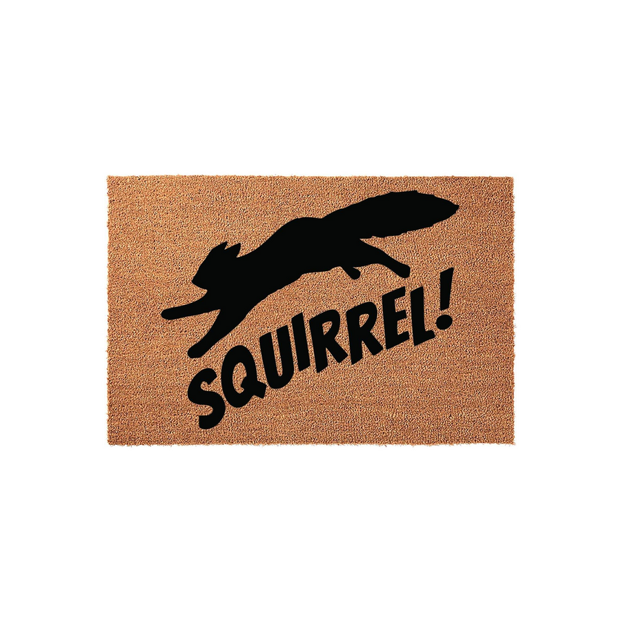 Squirrel Doormat featuring a natural coir texture with a black silhouette of a dog leaping in excitement, accompanied by the bold text SQUIRREL! printed in a playful font on this durable outdoor welcome mat for pet lovers.