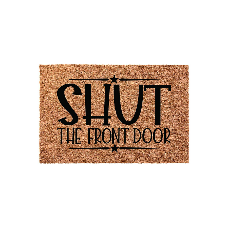 Shut The Front Door coir doormat featuring bold black typography and decorative star accents on a natural tan fiber background, creating a humorous and welcoming entrance mat for your home porch or entryway decor.