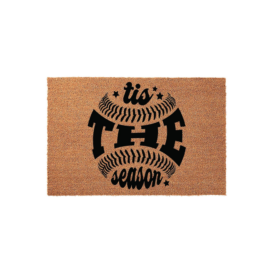 Tis The Season baseball doormat featuring a natural coir texture with a bold black graphic of a baseball and festive holiday typography, making it a fun sports-themed welcome mat for any front porch or entryway during the winter