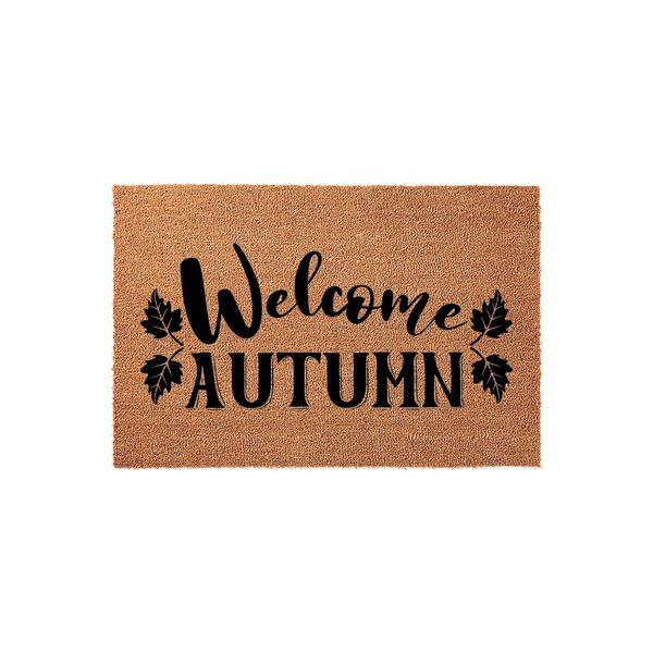 Welcome Autumn coir doormat featuring a natural brown fiber texture with black script lettering and decorative leaf accents, providing a festive seasonal entryway decor piece for your front porch during the fall harvest season.
