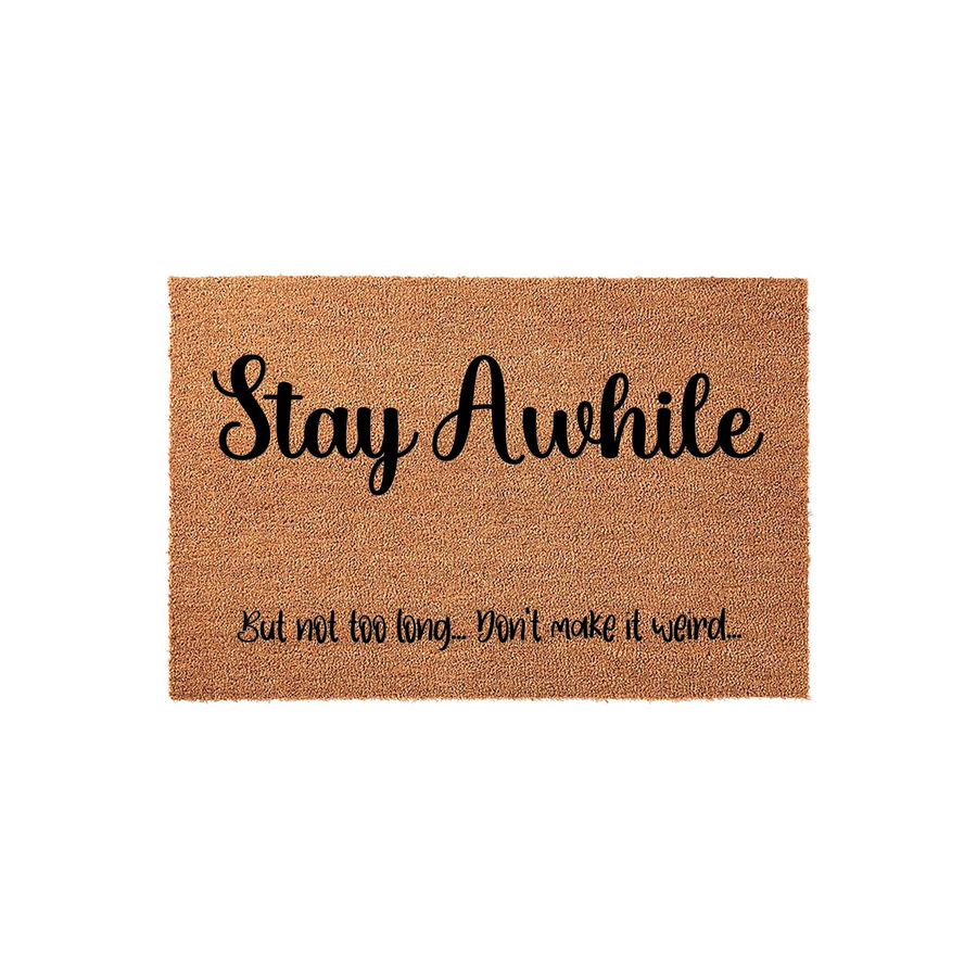 Funny Stay Awhile doormat made of natural coir fiber with a black printed message that reads Stay Awhile but not too long, don't make it weird, perfect for a humorous front porch entryway decor on a plain white studio background.