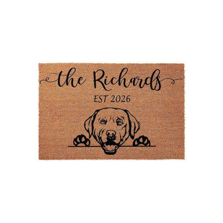 Personalized Labrador Retriever doormat featuring a cute dog illustration peeking over a line, customized with a family name and established year on a natural coir fiber background for a welcoming and durable home entrance decor