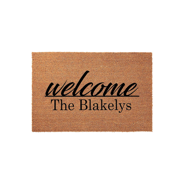 Personalized family name coir doormat featuring a natural tan fiber texture and bold black lettering that says welcome above a custom last name, providing a classic and durable entryway decor piece for any home front porch or